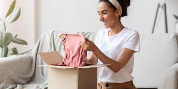 happy young woman opening carton box checking delivery copy space