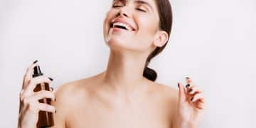 satisfied brunette girl after shower sprays mist body skin woman smiling isolated wall